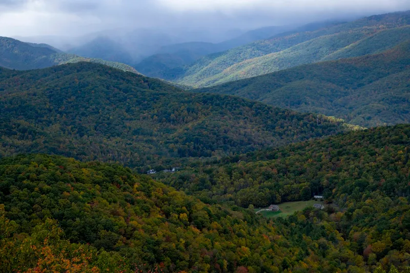 Forested Appalachian hills with homes tucked in the valleys